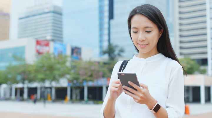 H1b selections - woman holding phone